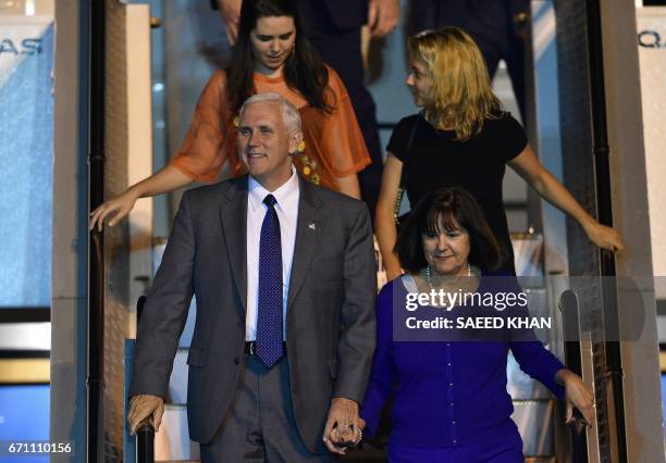 Vice President Mike Pence , his wife Karen , and their two daughters Audrey and Charlotte exit the plane as they arrive at Sydney airport on April...