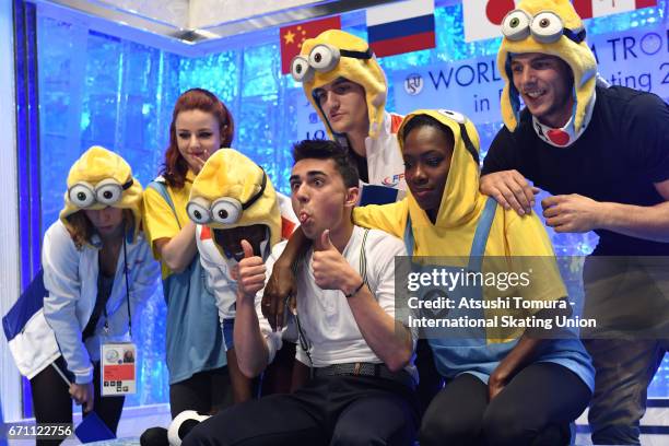 Kevin Aymoz of France react with his team mates at the kiss and cry after the Men free skating during the 2nd day of the ISU World Team Trophy 2017...