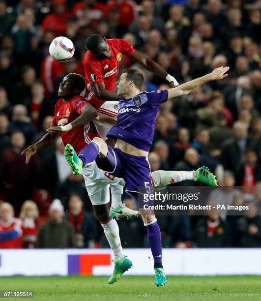 Anderlecht's Uros Spajic battles for the ball with Manchester United's Paul Pogba and Manchester United's Eric Bailly
