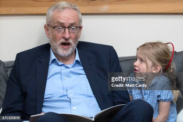 Labour party leader Jeremy Corbyn reads the book 'We're Going on a Bear Hunt' to children at a visit to Brentry Children's Centre, on April 21, 2017...