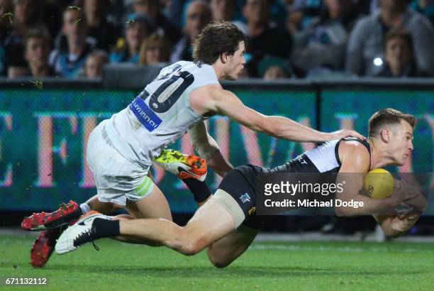 Robbie Gray of the Power competes for the ball against Lachie Plowman of the Blues during the round five AFL match between the Port Adelaide Power...