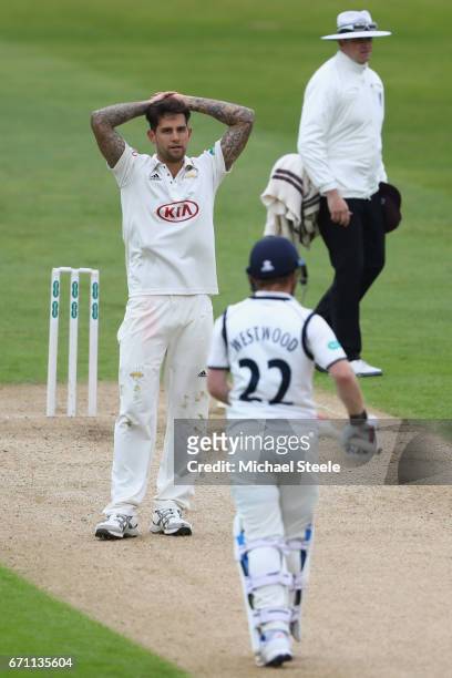 Jade Dernbach of Surrey shows his frustration after Ian Westwood of Warwickshire looks on during day one of the Specsavers County Championship...