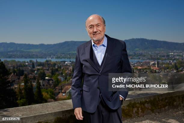 Former FIFA president Sepp Blatter poses during a photo session, past the city of Zurich, after an interview with news agencies on April 21, 2017 in...