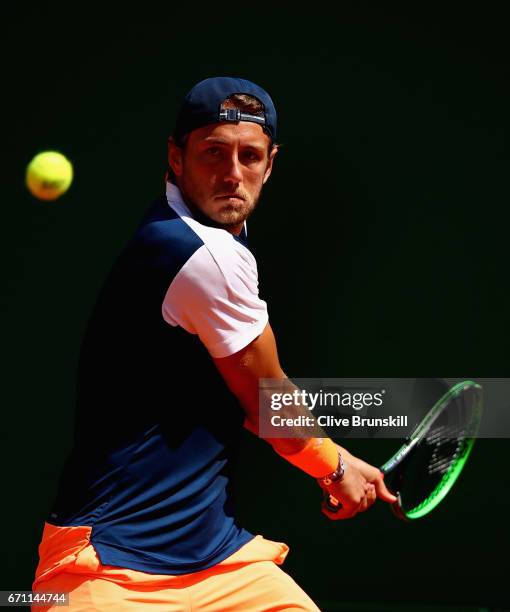 Lucas Pouille of France plays a backhand against Pablo Cuevas of Uruguay in their quarter final round match on day six of the Monte Carlo Rolex...