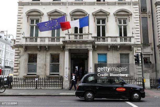 London taxi passes the French consulate in London, U.K., on Friday, April 21, 2017. Three days before the first round of voting for their next...