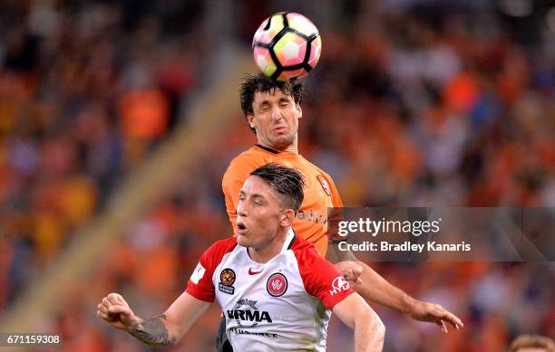 Thomas Broich of the Roar gets above Scott Neville of the Wanderers as the compete for the ball during the A-League Elimination Final match between...