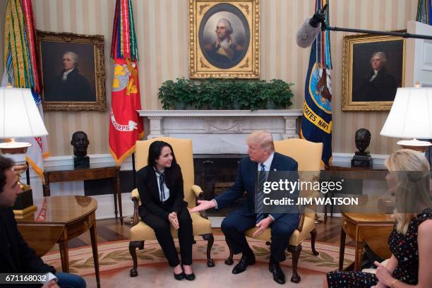 President Donald Trump meets with Aya Hijazi, an Egyptian-American aid worker at the White House in Washington, DC, April 21, 2017. Hijazi was flown...