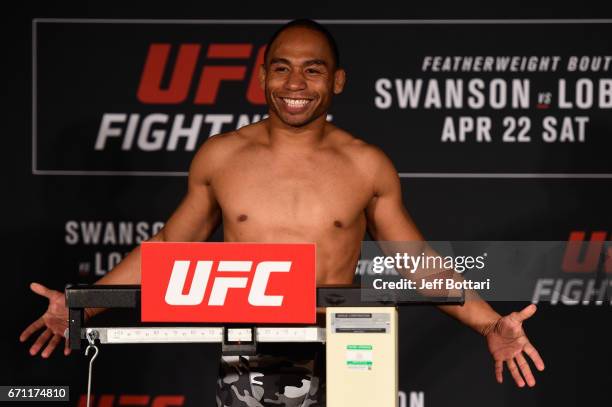 John Dodson poses on the scale during the UFC Fight Night weigh-in at the Sheraton Music City Hotel on April 21, 2017 in Nashville, Tennessee.