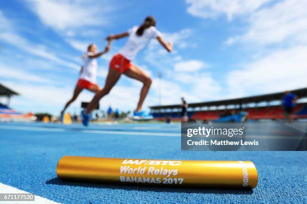 Baton is displayed in the foreground as athletes practice prior to the IAAF / BTC World Relays Bahamas 2017 at the Thomas Robinson Stadium on April...