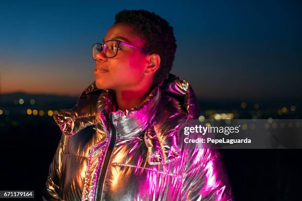 young girl and city lights - purple jacket stock pictures, royalty-free photos & images