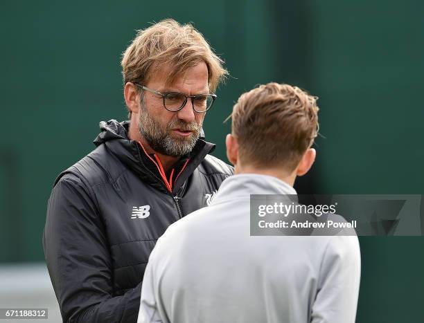 Jurgen Klopp manager of Liverpool talks with Lucas Leiva during a training session at Melwood Training Ground on April 21, 2017 in Liverpool, England.