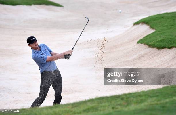 Jimmy Walker plays his shot out of the bunker on the 15th hole during the second round of the Valero Texas Open at TPC San Antonio AT&T Oaks Course...