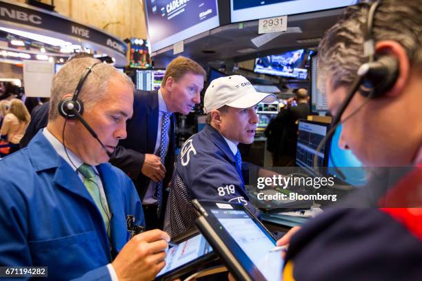 Traders work on the floor of the New York Stock Exchange in New York, U.S., on Friday, April 21, 2017. U.S. Stocks fluctuated, while Treasuries...