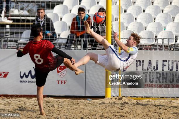 Baris Terzioglu of Turkey in action against Aaron Clarke of England during the 12th Tulips Festival International Beach Soccer Tournament 2nd match...