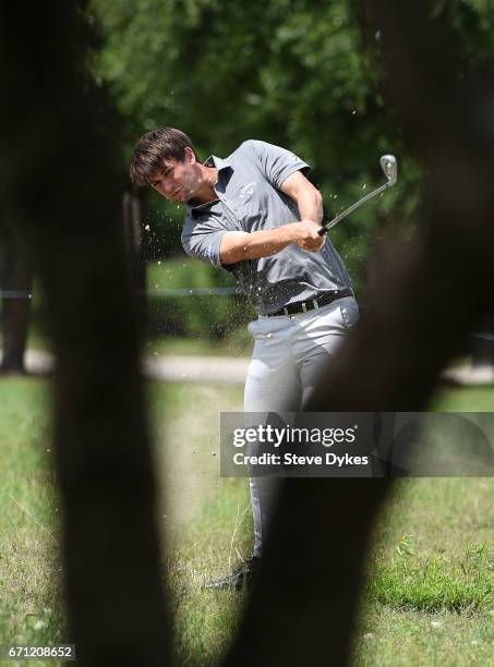 Ollie Schniederjans plays his shot out of the rough on the 18th hole during the second round of the Valero Texas Open at TPC San Antonio AT&T Oaks...