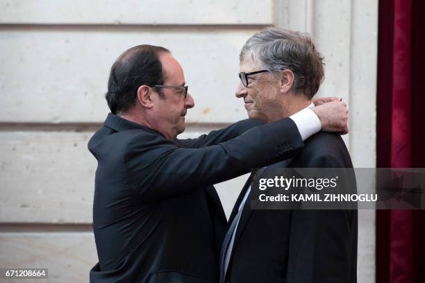 Microsoft co-founder Bill Gates receives the Commander of the Legion of Honor title from French President Francois Hollande awards at the Elysee...