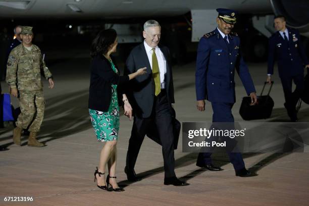 Defense Secretary James Mattis is greeted by U.S. Ambassador to Qatar Dana Shell Smith and Qatar Ministry of Defense Director of International...