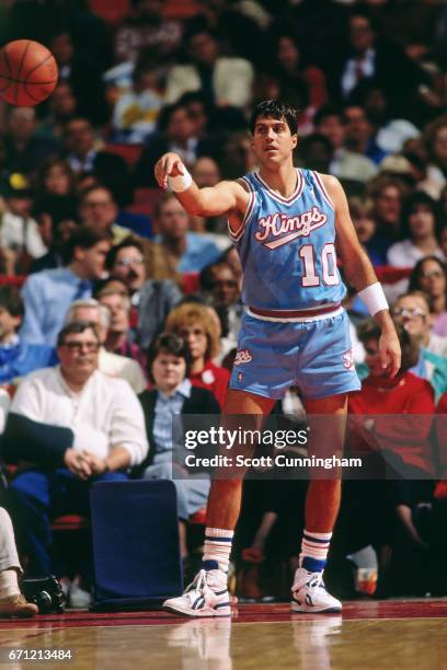 Randy Wittman of the Sacramento Kings passes the ball against the Atlanta Hawks during a game played circa 1990 at the Omni in Atlanta, Georgia. NOTE...