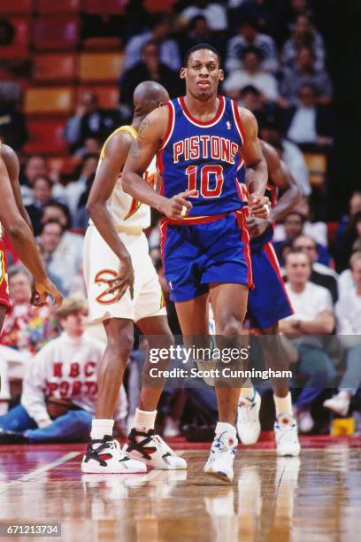 Dennis Rodman of the Detroit Pistons runs against the Atlanta Hawks during a game played circa 1990 at the Omni in Atlanta, Georgia. NOTE TO USER:...