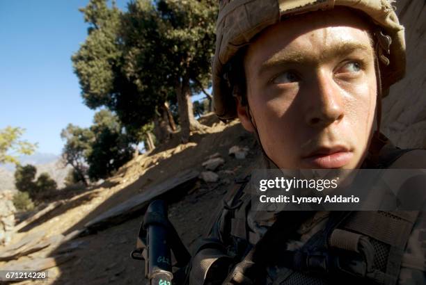 Garrett Clary with the first platoon of the 173rd battle company on patrol in a village near Vegas base in the Korengal valley. Afghanistan, October...
