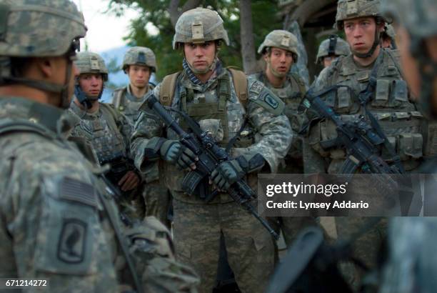 Lt. Brad Winn front left, of Battle Company, 173rd Division, speaks to his troops before leading them on a patrol through very hostile villages in...