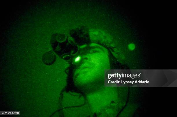 American soldiers with the 173rd battle company, on a battalion-wide mission in the korengal valley, Afghanistan. Through night-vision goggles: JTAC...