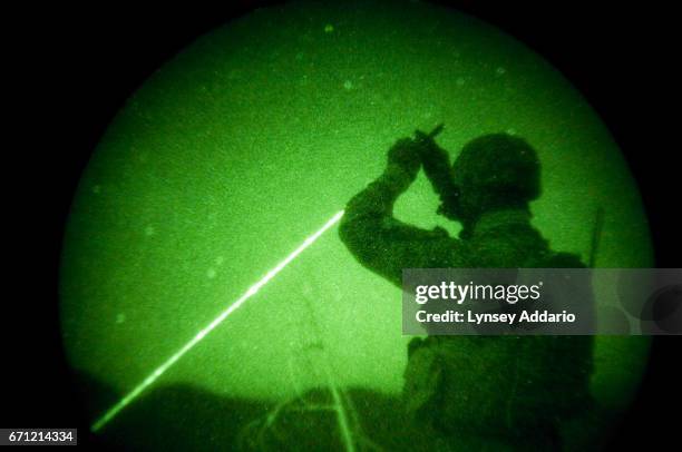 American soldiers with the 173rd battle company, on a battalion-wide mission in the korengal valley, Afghanistan. Through night-vision goggles: JTAC...