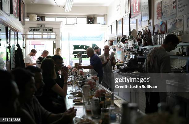 Swan Oyster Depot patrons sit in the dark during a citywide power outage on April 21, 2017 in San Francisco, California. Nearly 100,000 Pacific Gas...