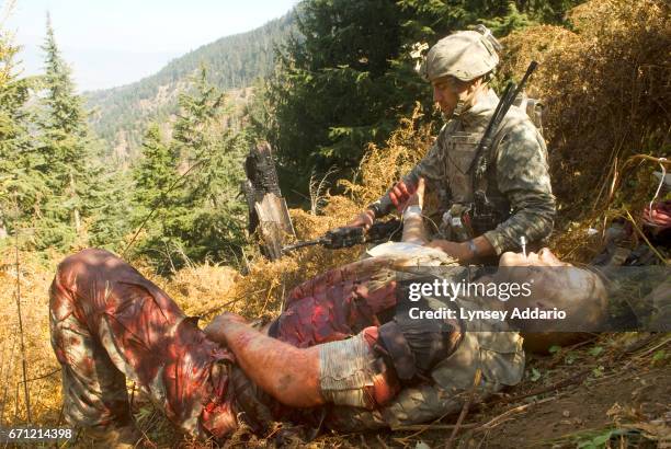 American soldiers with the 173rd battle company, on a battalion-wide mission in the Korengal valley, looking for caves and weapons caches and known...