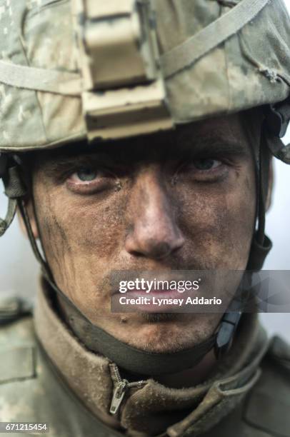 Soldiers with the 173rd battle company, on a battalion-wide mission in the Korengal valley in the village of Yakachina. Captain Dan Kearney watches...