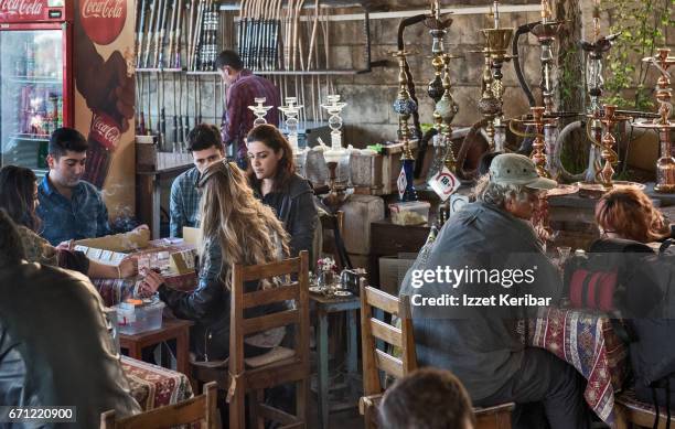 hokkah ( narghile ) cafe in center gaziantep, soutehastern turkey - pipe smoking women stock pictures, royalty-free photos & images