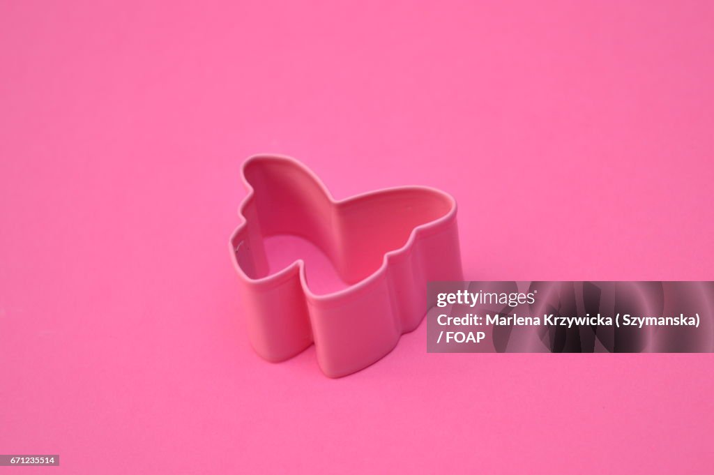 Cookiecutter shark against pink background