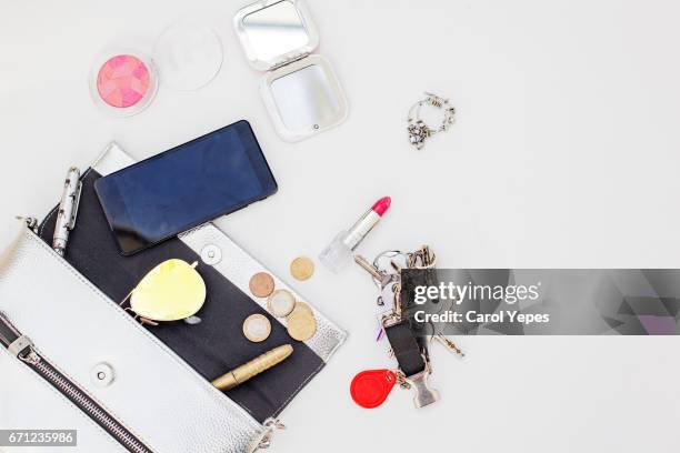content of woman bag.overhead shot - make up table stock pictures, royalty-free photos & images