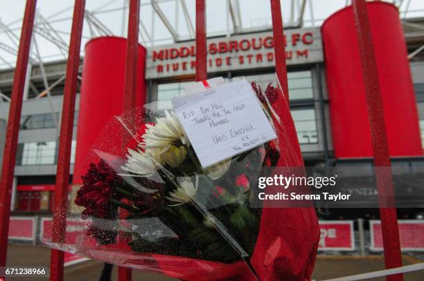 Memorabilia hangs on the metal gates outside the riverside stadium in memory of Ugo Ehiogu during the Premier League 2 match between Middlesbrough...