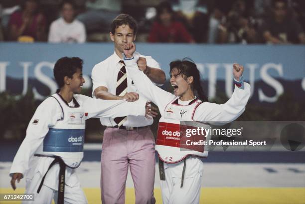 Chinese Taipei taekwondo athlete Lo Yueh-Ying raises her arms in the air after beating Rahmi Kurnia of Indonesia to win the gold medal in the final...