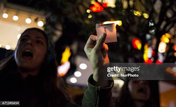 Woman burs a Ballot paper on April 20, 2017 in Istanbul, Turkey during the protesters march in opposition to perceived voting irregularities in...