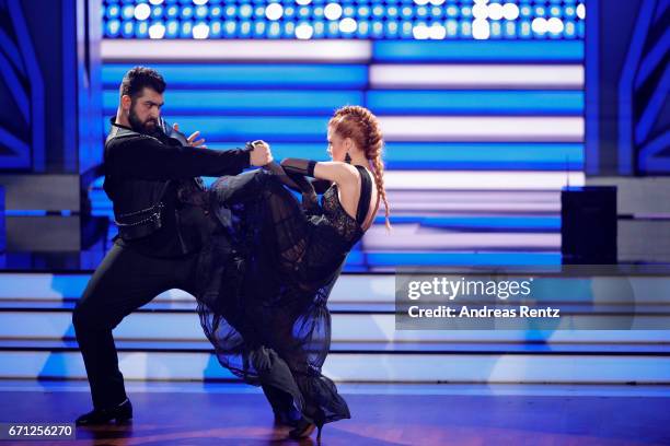 Faisal Kawusi and Oana Nechiti perform on stage during the 5th show of the tenth season of the television competition 'Let's Dance' on April 21, 2017...