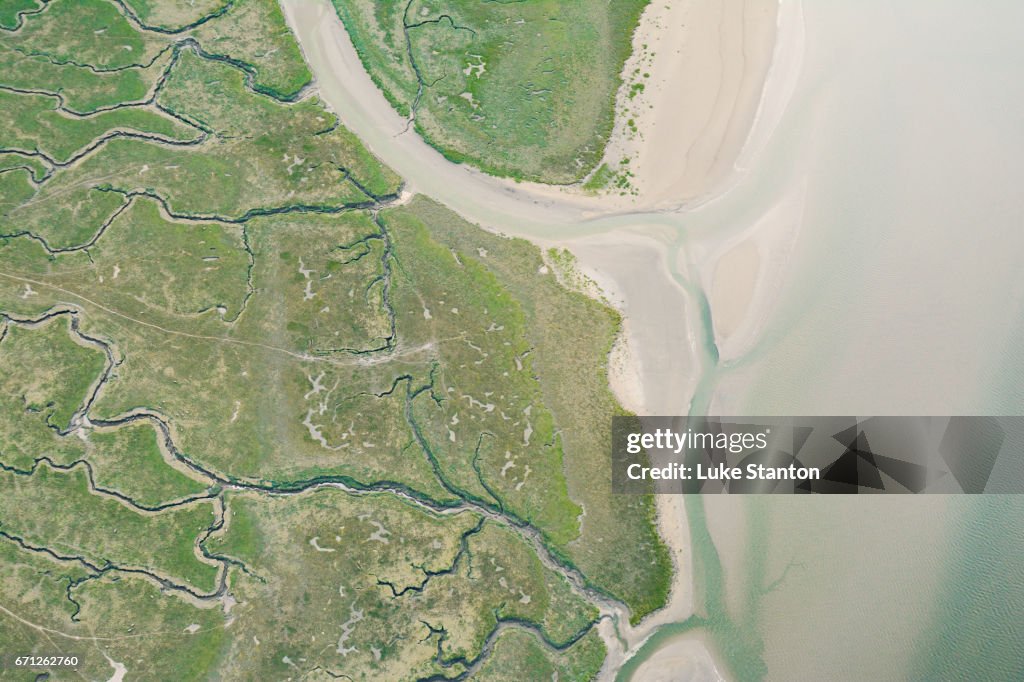 Aerial view of marshes and shoreline in Wales