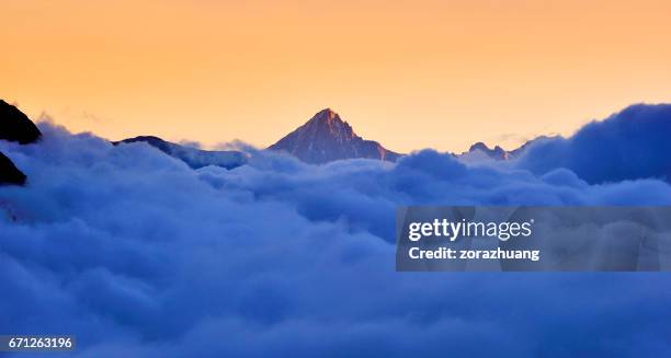 matterhorn in the stratosphere cloud at sunrise - mountain peak through clouds stock pictures, royalty-free photos & images