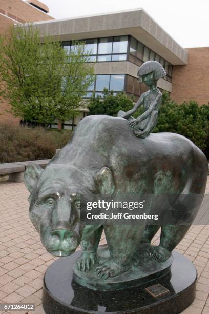 Bronze cast of a Boy and Bear.