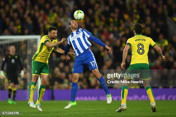 Glenn Murray of Brighton is challenged by Russell Martin and Jonny Howson of Norwich during the Sky Bet Championship match between Norwich City and...