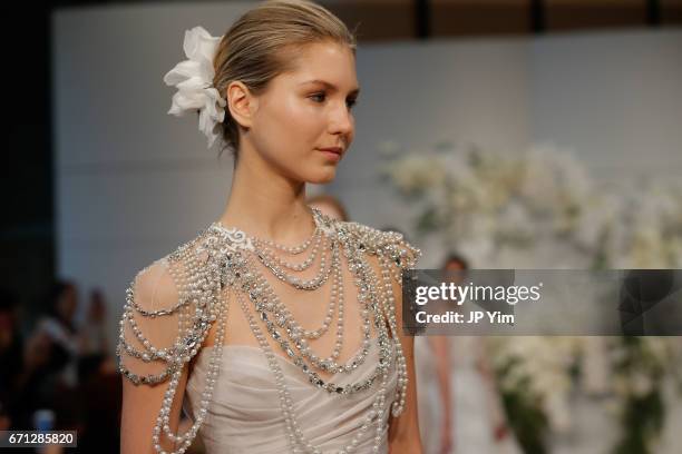 Model walks the runway at the Monique Lhuillier Spring 2018 Bridal show at Carnegie Hall on April 21, 2017 in New York City.