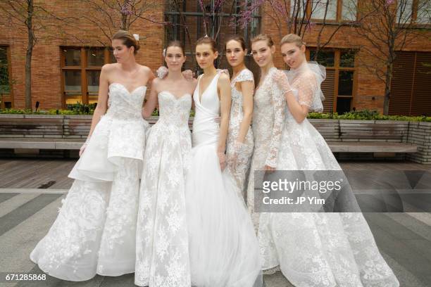 Models pose prior to the Monique Lhuillier Spring 2018 Bridal show at Carnegie Hall on April 21, 2017 in New York City.