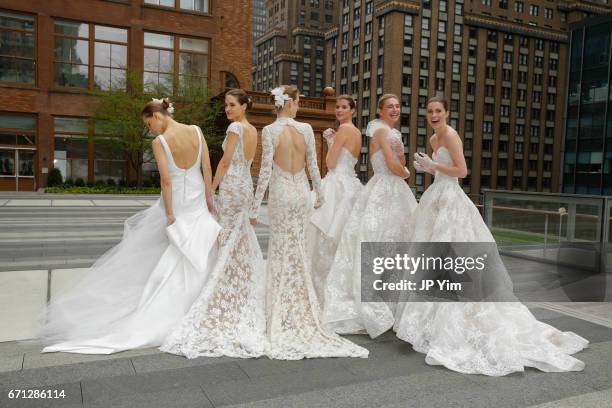 Models pose prior to the Monique Lhuillier Spring 2018 Bridal show at Carnegie Hall on April 21, 2017 in New York City.