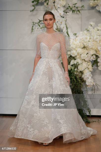 Model walks the runway at the Monique Lhuillier Spring 2018 Bridal show at Carnegie Hall on April 21, 2017 in New York City.