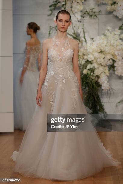 Model walks the runway at the Monique Lhuillier Spring 2018 Bridal show at Carnegie Hall on April 21, 2017 in New York City.