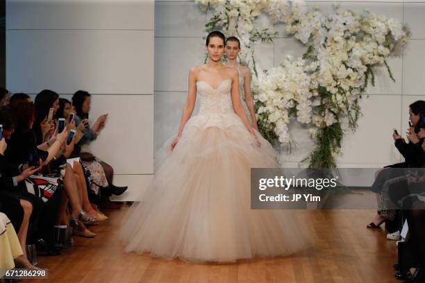 Model walks the runway at the Monique Lhuillier Spring 2018 Bridal show at Carnegie Hall on April 21, 2017 in New York City.