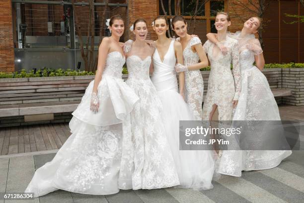 Models pose prior to the Monique Lhuillier Spring 2018 Bridal show at Carnegie Hall on April 21, 2017 in New York City.