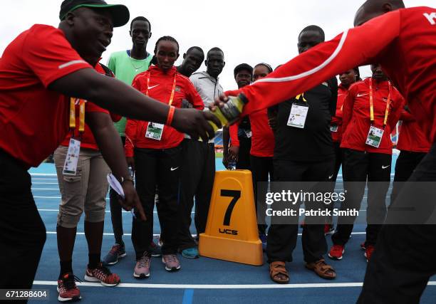 Gai Nyang Tap and Dominic Lokinyomo Lobalu of the Athlete Refugee Team speak to team Kenya during practice prior to the IAAF / BTC World Relays...