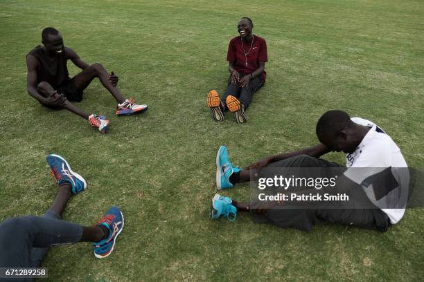 Wiyual Puok Deng , Paulo Amotun Lokoro , Dominic Lokinyomo Lobalu and Gai Nyang Tap of the Athlete Refugee Team practice prior to the IAAF / BTC...